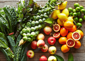 a group of fruits and vegetables on a wood surface Healthy Weight Loss Diets Wales